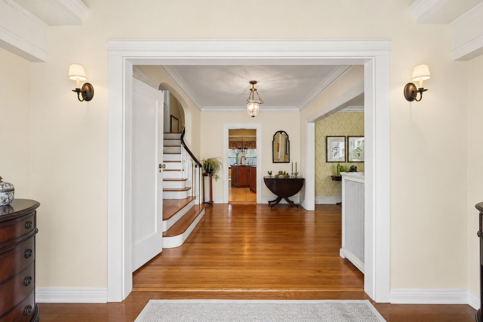Rich hardwood floors, graceful architectural openings, and beautiful natural light create a warm welcome from the moment you step inside.