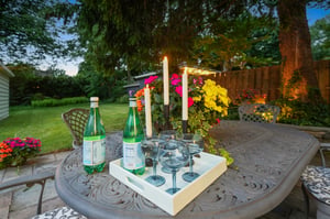 As the sun slips away and the candles are lit, the backyard takes on a little magic.