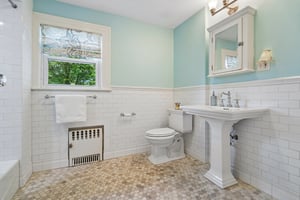 The 2nd floor hall bath is thoughtfully updated with classic finishes and serves the additional bedrooms with ease and style.