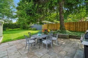 A canopy of green overhead. An expansive private backyard retreat. Birdsong in the background. Plenty of room for dinner, drinks, and lingering a little longer than planned.