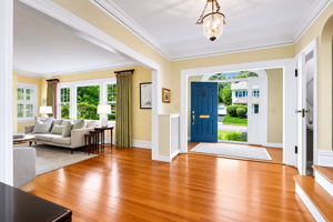The light-filled entry feels open, bright, and happy - just begging for grand entrances. With a powder room nearby and sunlight bouncing throughout the space, it's a welcome you'll never tire of coming home to.
