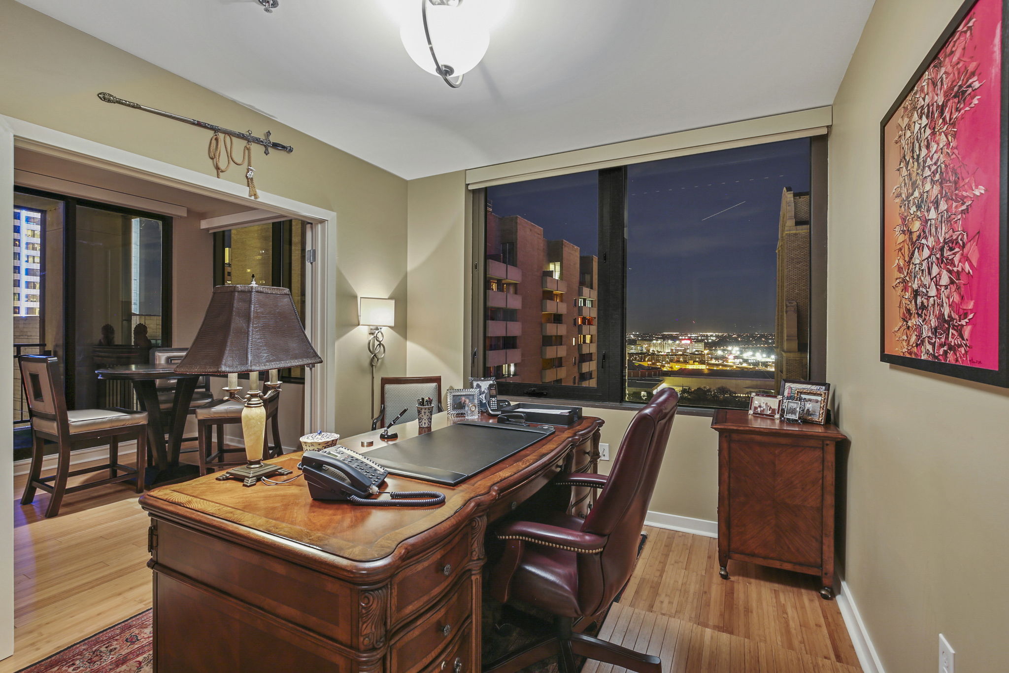 1912 Study / Office •	Custom Cabinets – Bookcase + Storage •	Double French Doors with views of Downtown