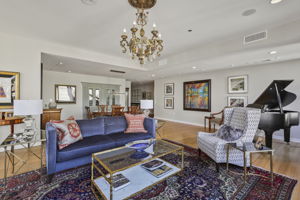 1912 Dining Room + Living Room •	2 – Lighted Custom Built-in Display & Storage Cabinets •	2 – Chandeliers