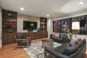 1901 Family Room •	Redstone Entertainment Wall Cabinets, floating smoked glass shelves, flat panel Brown Poly Gloss