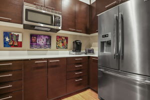 1901 Butler's Pantry •	Frigidaire Professional Refrigerator, stainless French Doors •	Maytag Microwave •	Countertops & Cabinets •	Barn Door (sliding double doors)