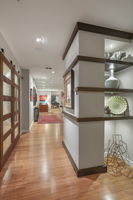 1901 Entrance •	Custom Art Display Shelving with Art Lighting