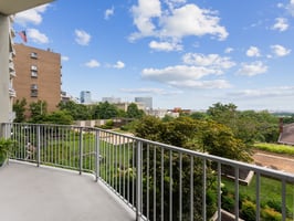 Balcony overlooks well manicured gardens