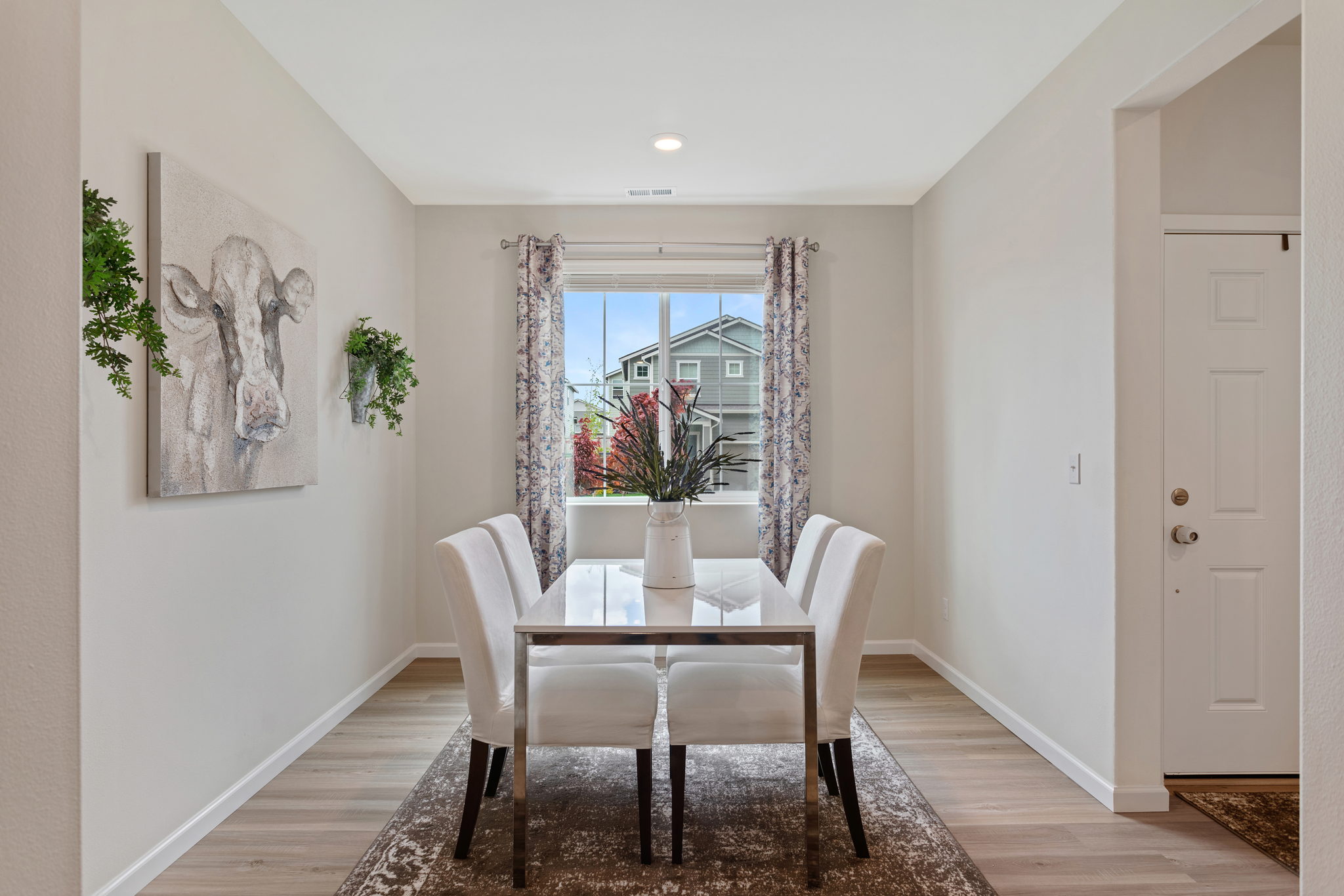 Large Dining room with big picture window lets in the sunlight