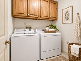 AI Staged - Upstairs Laundry Room with built-in cabinetry and ceramic tile flooring