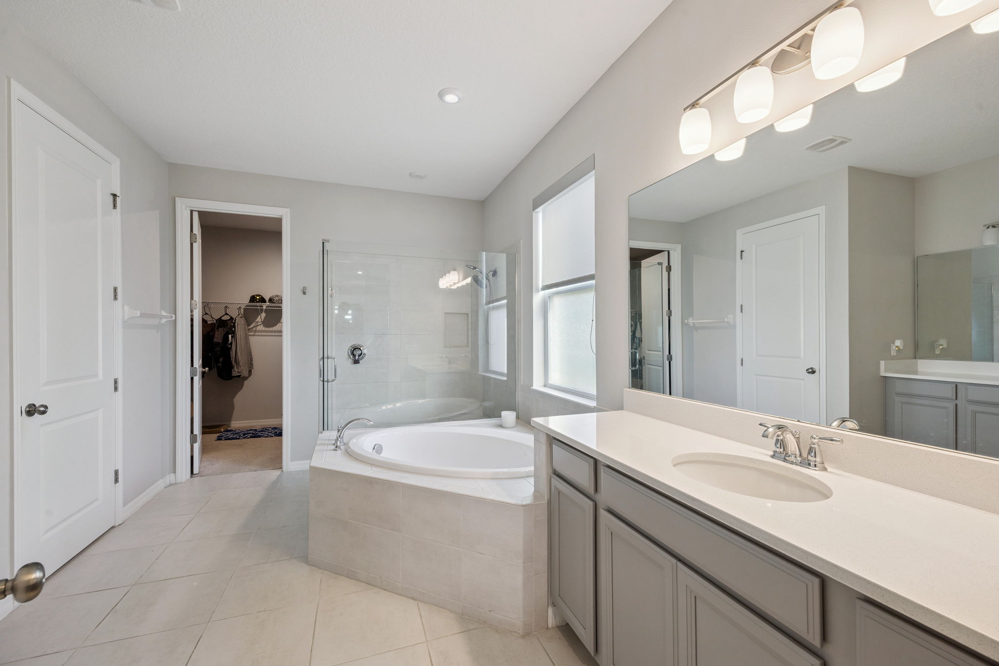 Primary Bathroom with Dual Vanities, Garden Tub and Separate Shower