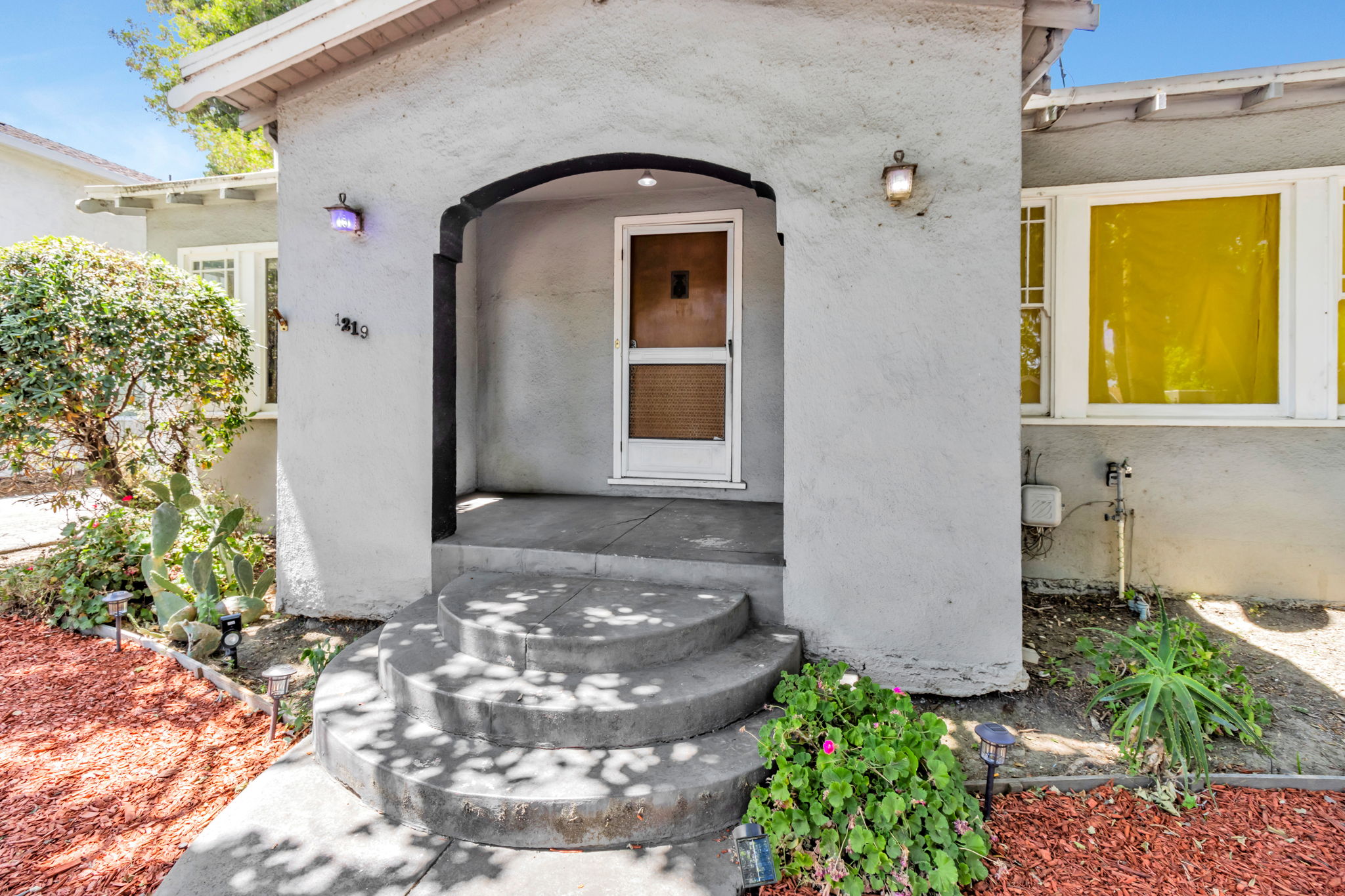 Welcoming Walkway with Lovely Rounded Entry!