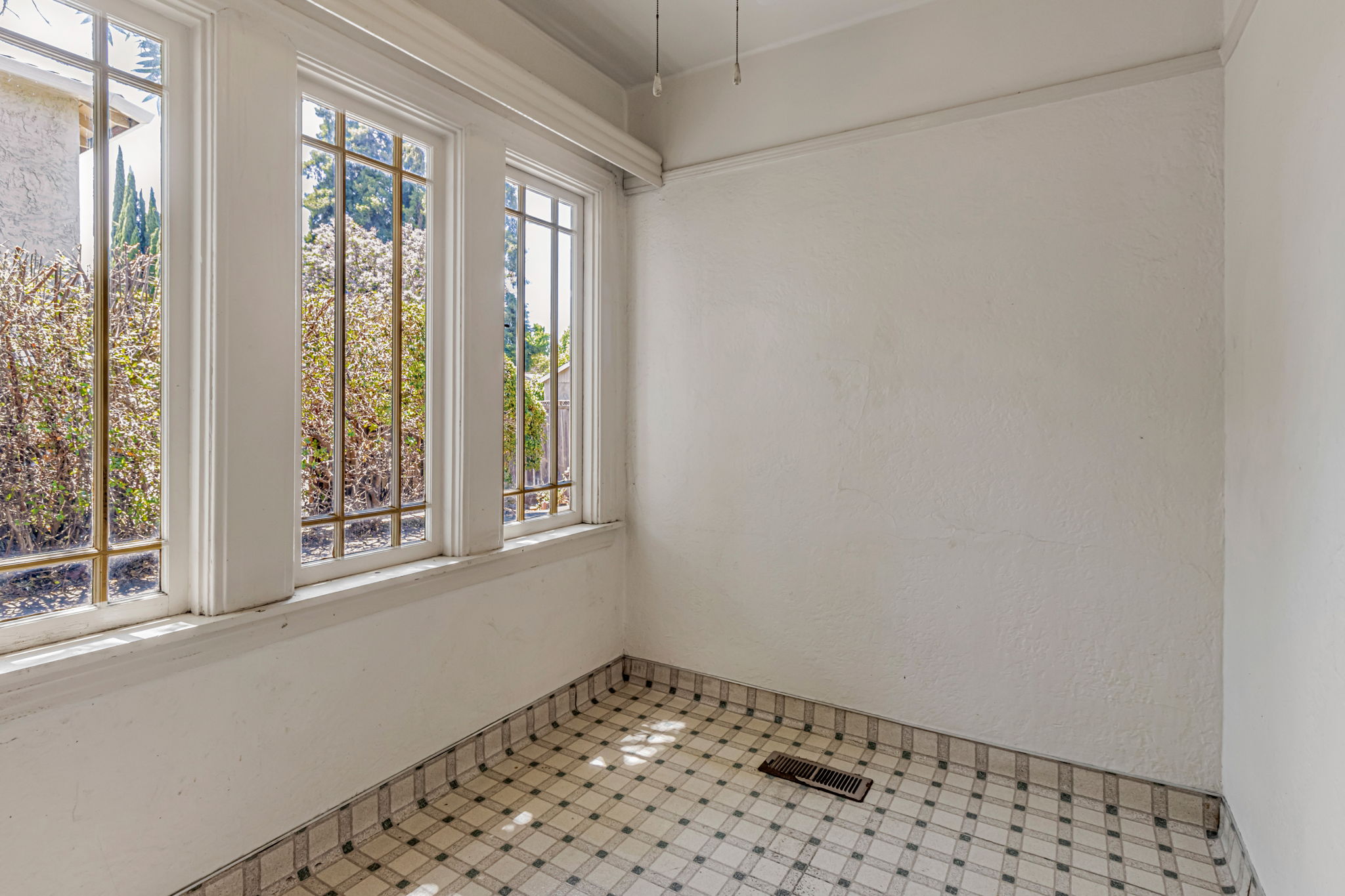 Elegant Original Windows Offer Abundant Natural Light & Views of the Lush Outdoor Space!