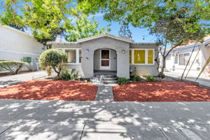 Charming Art Deco Arches Welcome You Up the Walkway to the Front PorchFront Yard Space with Inviting Front Walkway!