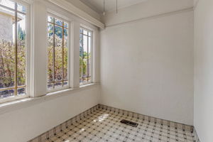 Elegant Original Windows Offer Abundant Natural Light & Views of the Lush Outdoor Space!