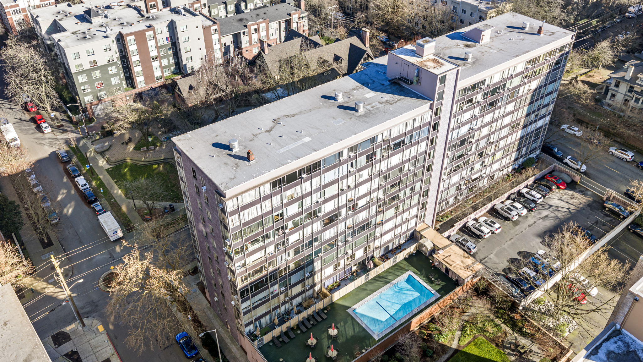 Sutton Place from above. Mid-century lines, an outdoor pool and sun deck, and First Hill at your doorstep.