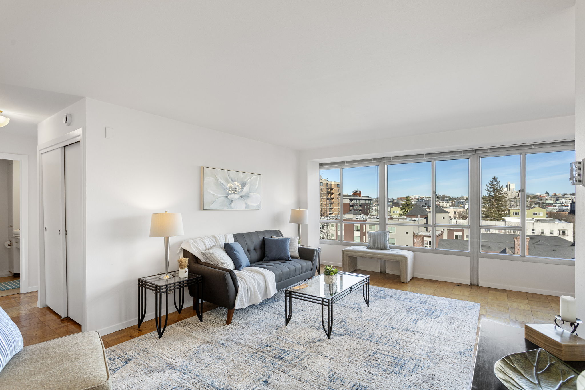 A simple, comfortable living room with clean lines, generous wall space, and light that stays with you.