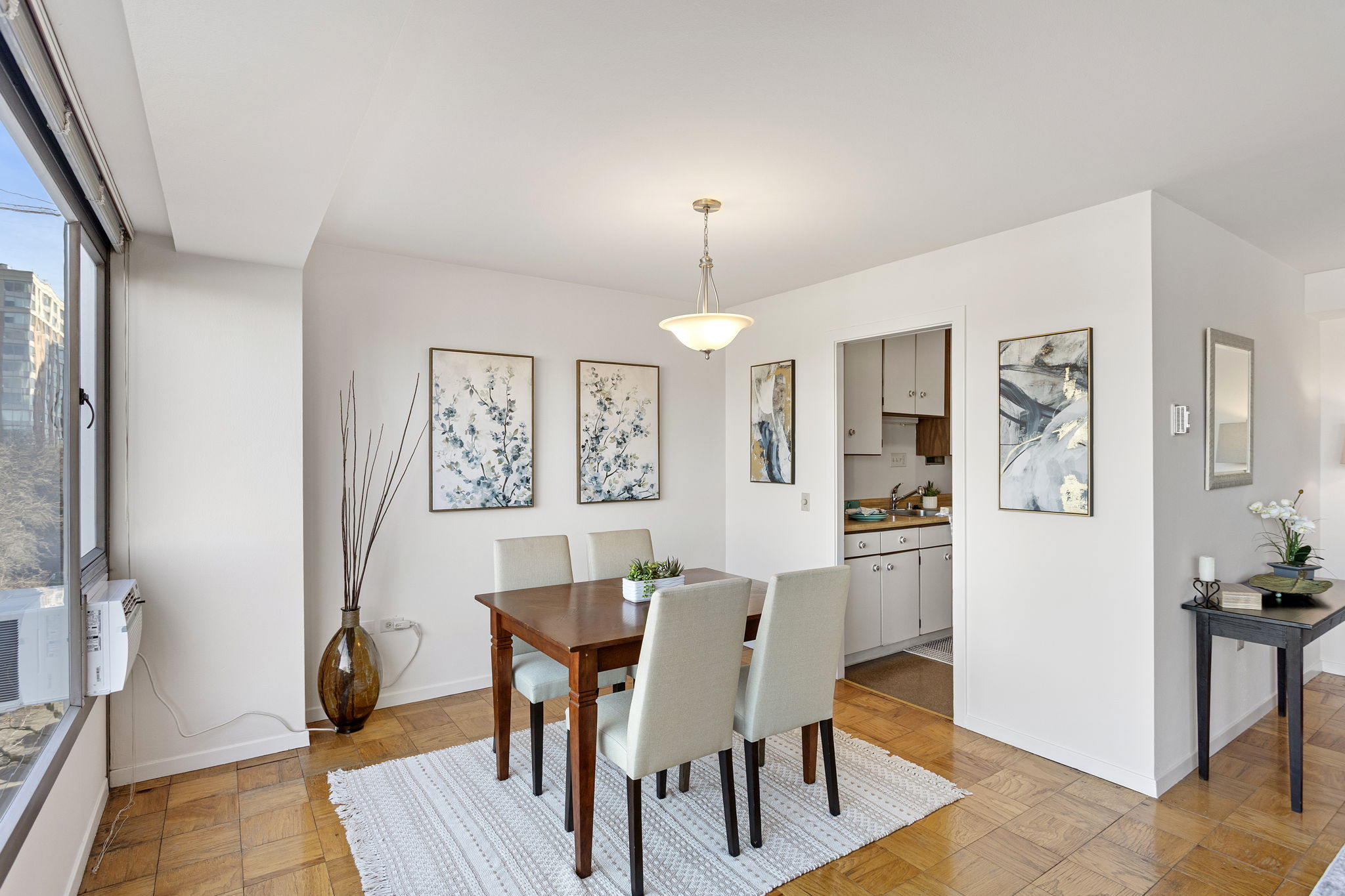 The dining space sits just off the kitchen entry, keeping the layout open, bright, and easy to live in.