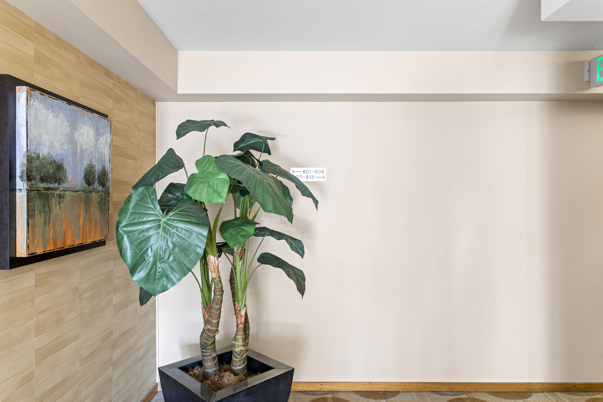 Eighth-floor arrival. A cared-for landing and clear wayfinding—small details that make coming home feel easy.