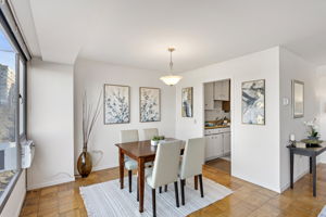 The dining space sits just off the kitchen entry, keeping the layout open, bright, and easy to live in.