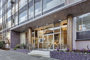 Welcome to Sutton Place. A classic glass entry with original mosaic detailing, set in the heart of First Hill.