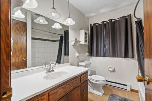 This bathroom also has an updated tiled shower