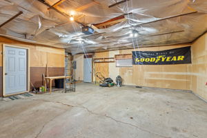 27x24 foot garage with extra workshop area in the back and rear man door to backyard and other detached garage