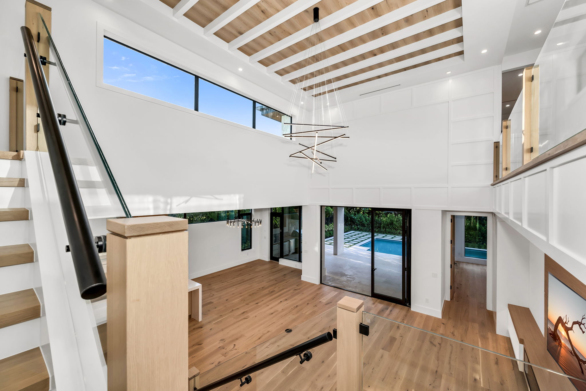 Staircase with a transitional landing creating a graceful turn.