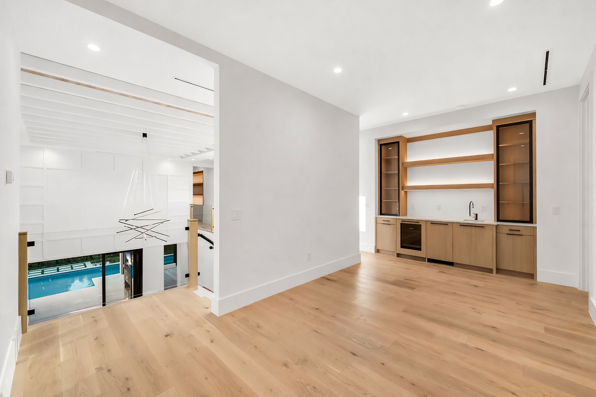 Guest loft featuring a wet bar and dishwasher for added comfort and convenience.
