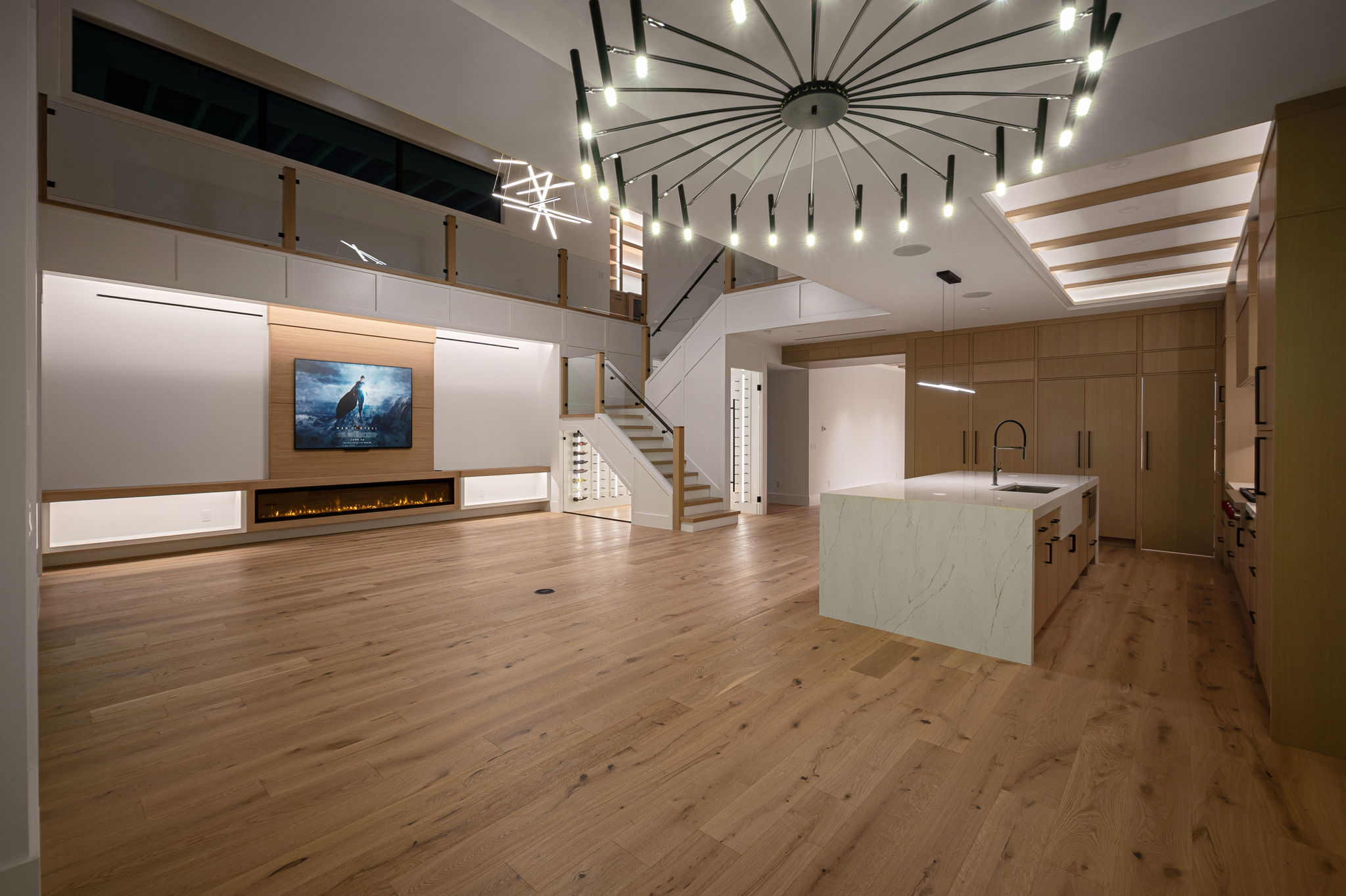 View 2 - Open living area designed for entertaining, enhanced with sleek low-voltage lighting throughout.