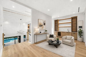 Virtually Staged - Guest loft featuring a wet bar and dishwasher for added comfort and convenience.