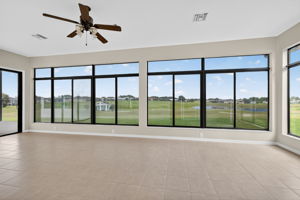 Immense Under-Air Enclosed Lanai with Golf and Water Views