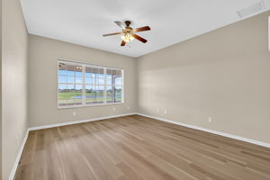 Primary Bedroom with Golf and Water Views