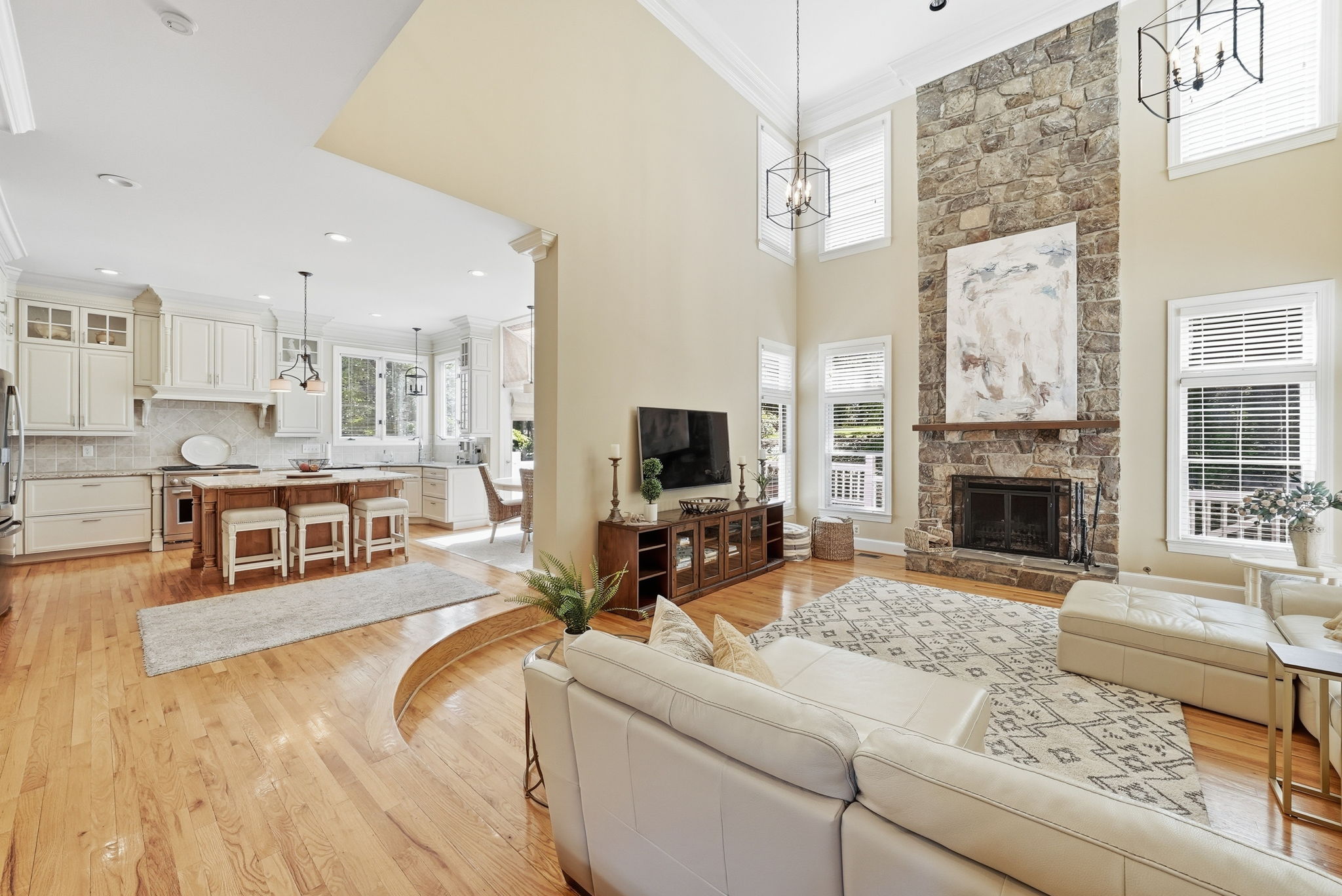 TWO-STORY GREAT ROOM WITH STONE FIREPLACE