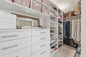 PRIMARY CLOSET WITH PROFESSIONAL BUILT-IN CABINETS