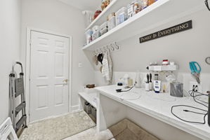 MUD ROOM WITH PLENTY OF STORAGE OFF THE GARAGE