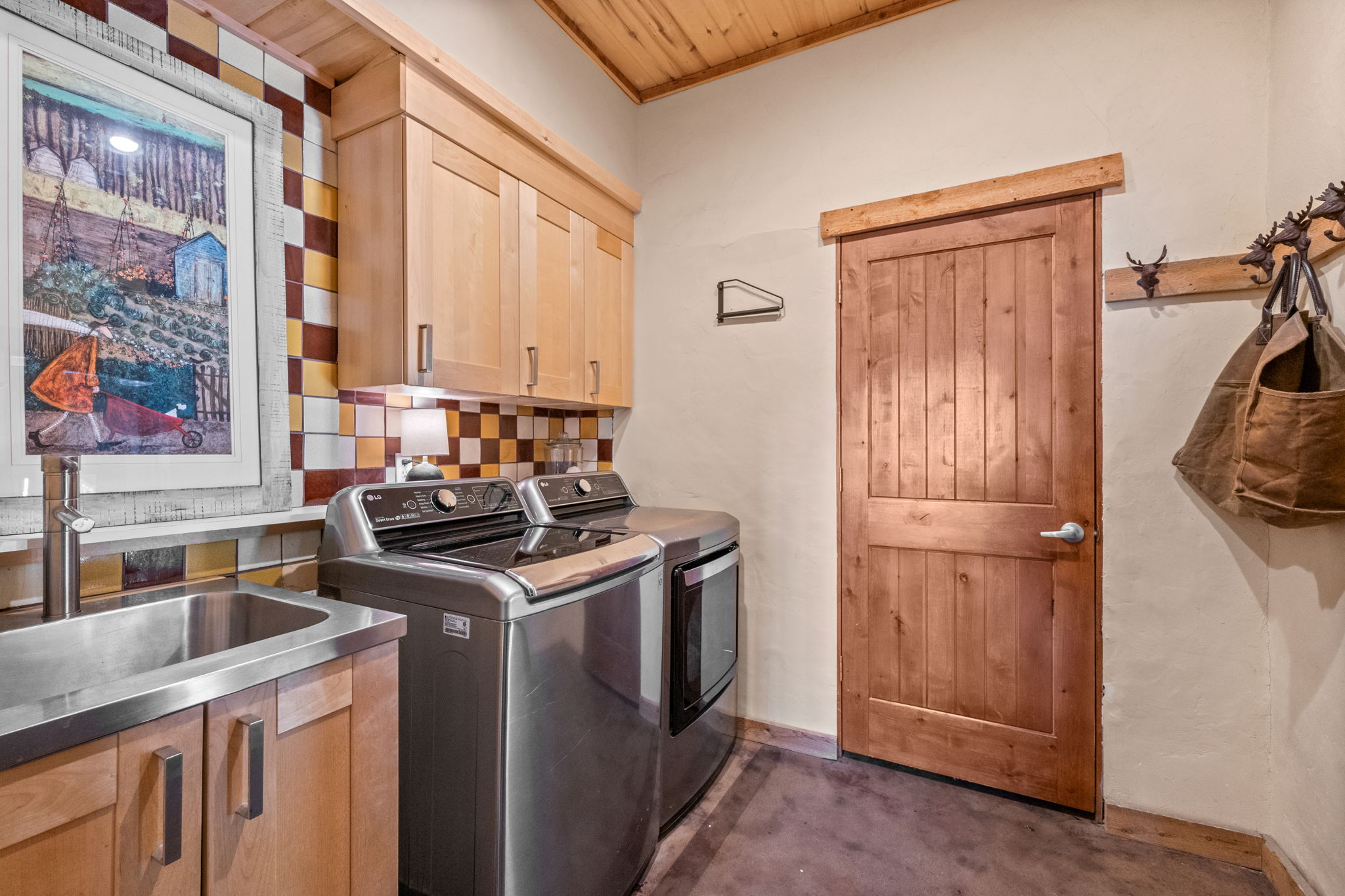 Laundry with Utility Sink Next to Mudroom