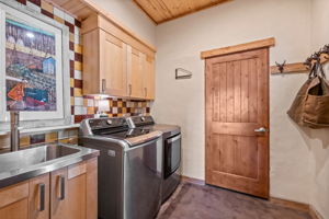 Laundry with Utility Sink Next to Mudroom