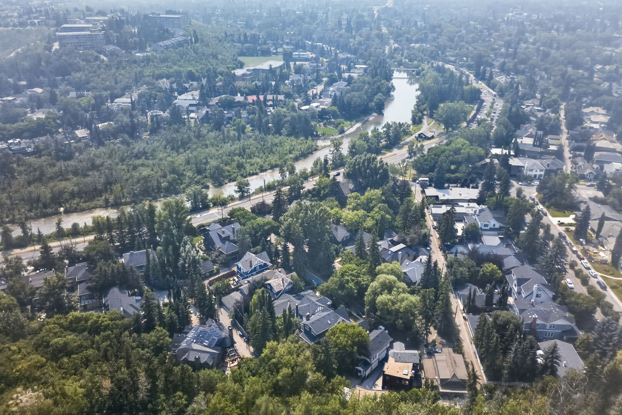 Steps from the Elbow River and its pathways