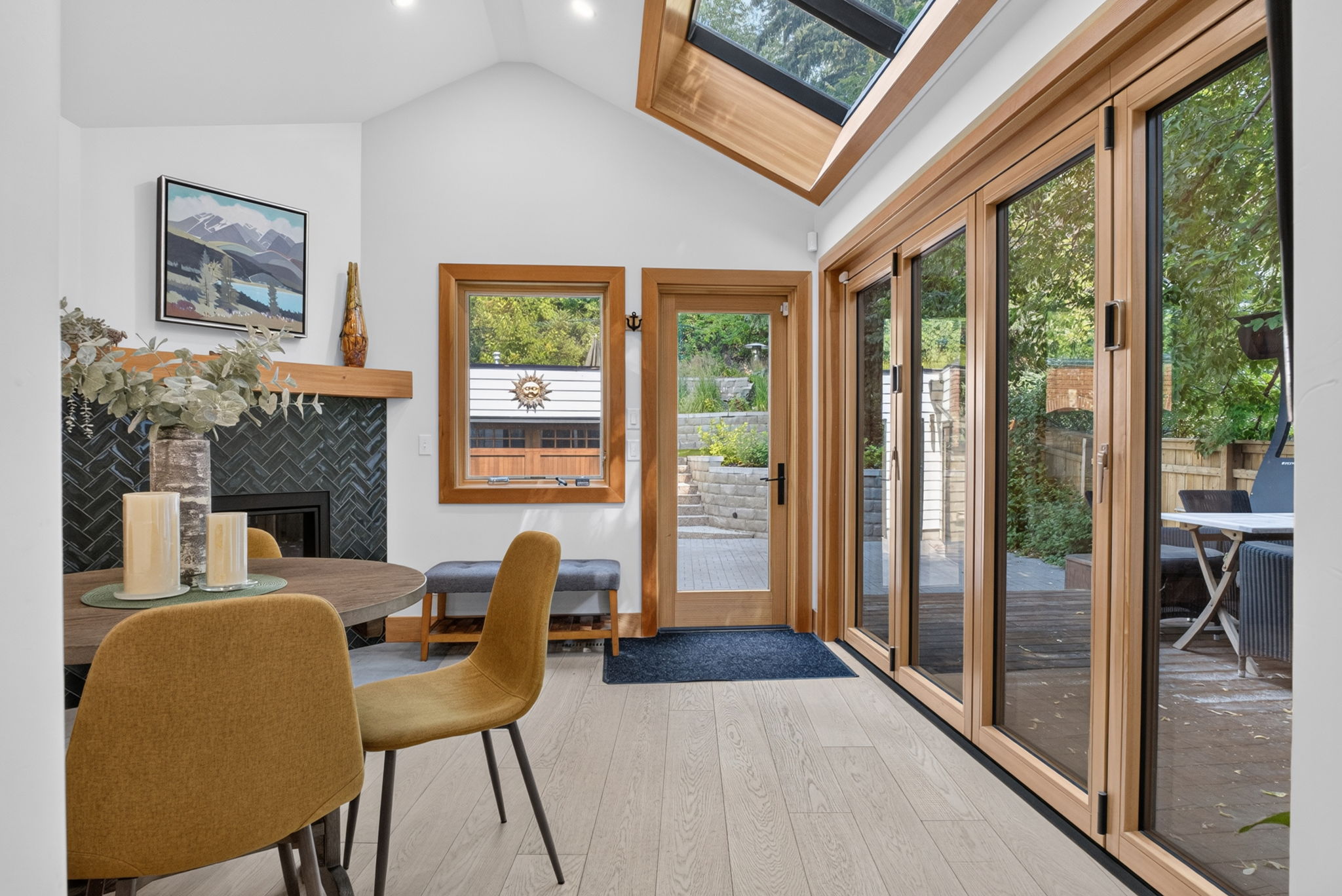 Sun-filled dining room opening to the rear deck