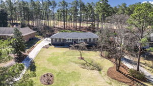 COMPLETELY remodeled one story on almost an acre, backing to private golf course, with pool.