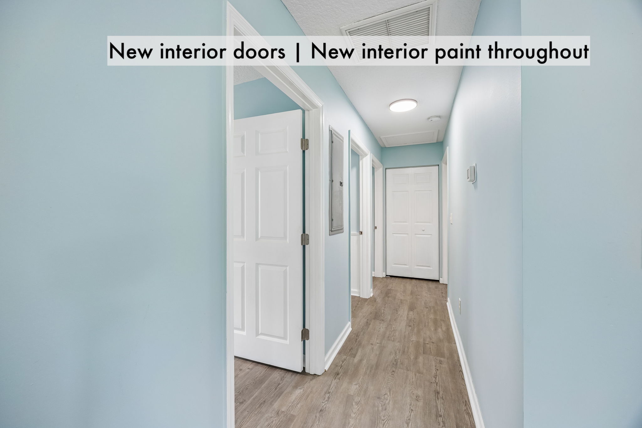 New interior doors, fresh paint and continuous plank flooring carry the renovation throughout the home