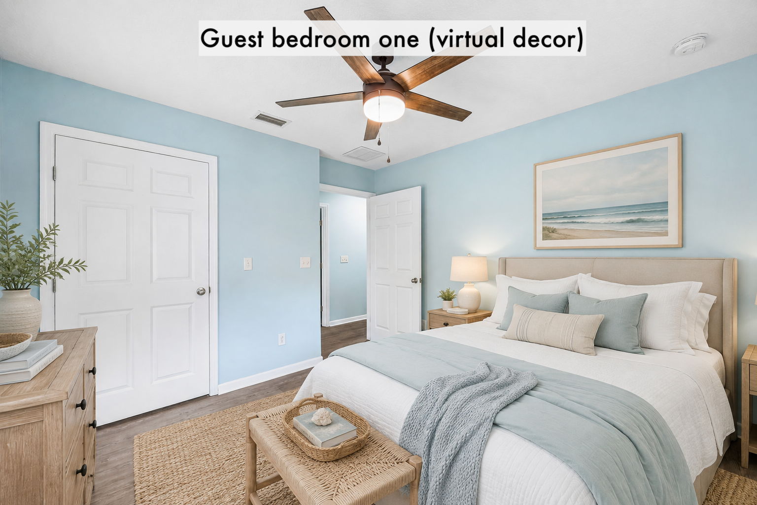 Guest bedroom one is virtually staged to show its comfortable proportions and relaxed coastal character ...
