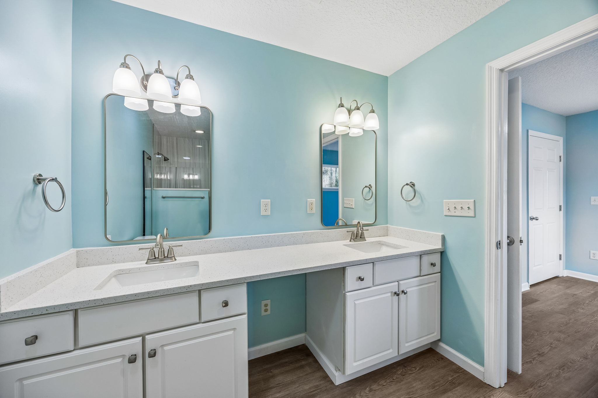 … and separate vanity areas provide useful personal space without sacrificing the room’s open feel