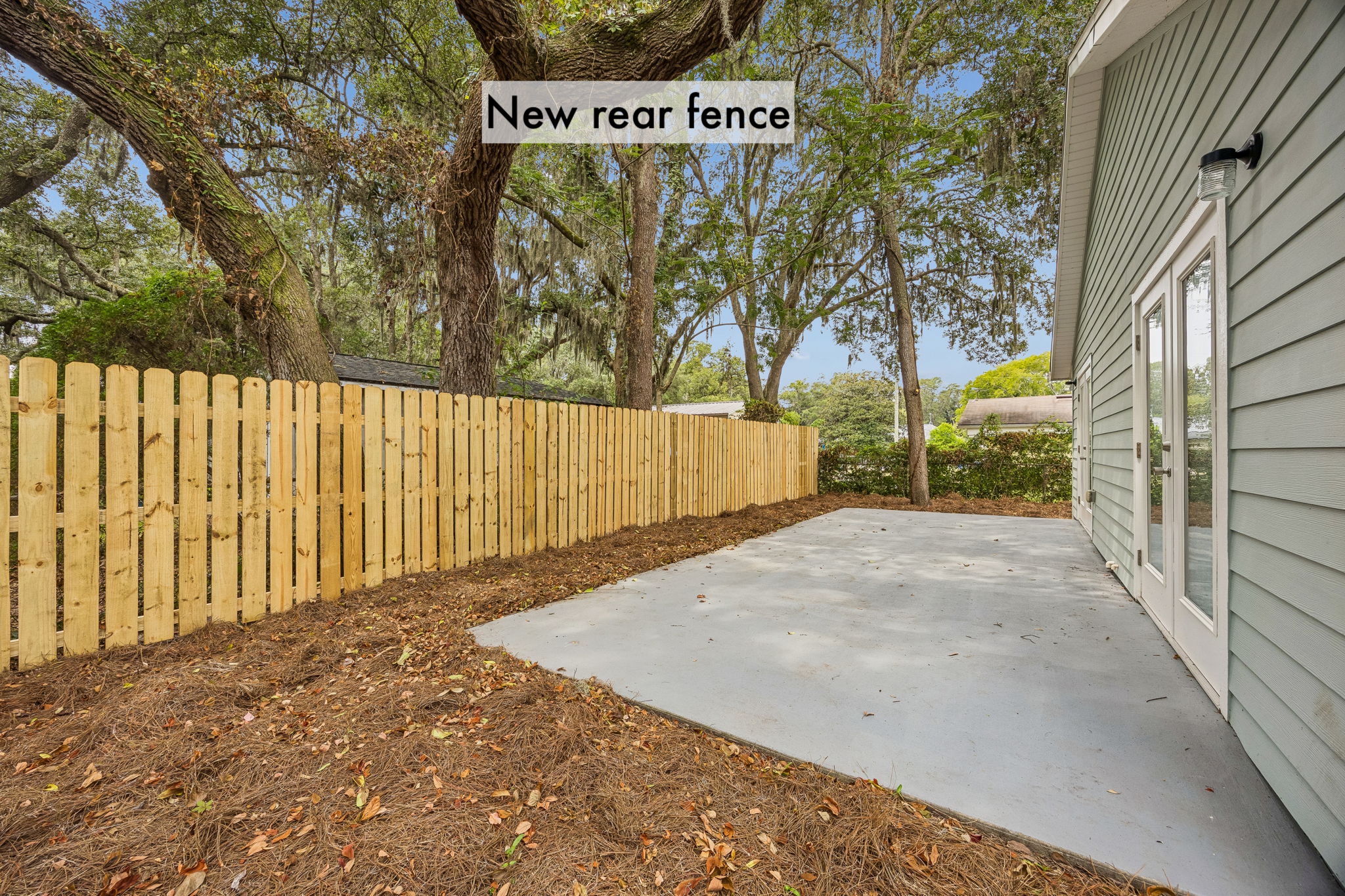 A newly fenced backyard creates a more private setting for outdoor dining, play or quiet evenings