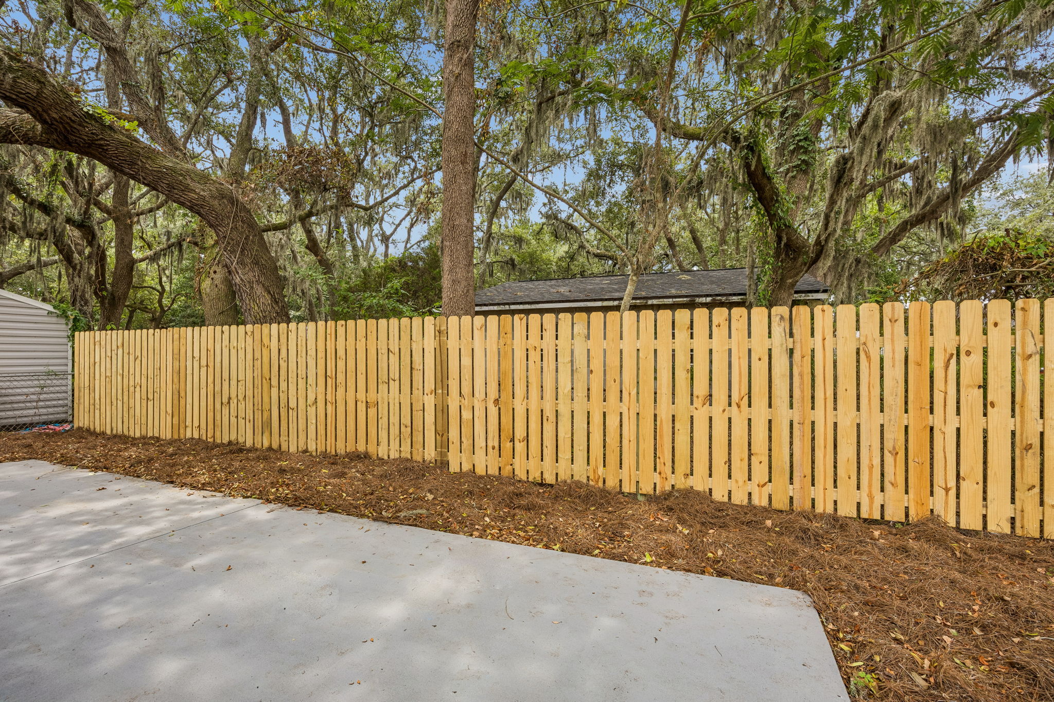… framed by mature oaks and Spanish moss that bring shade, character and a distinctly Fernandina setting