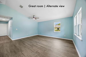 Multiple windows, vaulted ceilings and an open footprint gives the great room an inviting sense of space