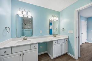 … and separate vanity areas provide useful personal space without sacrificing the room’s open feel