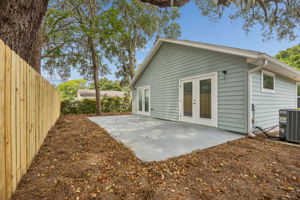 The broad concrete patio offers flexible space for seating, grilling and easy outdoor entertaining