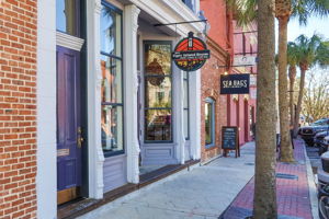 Historic storefronts house live music venues, independent boutiques and locally owned businesses ...