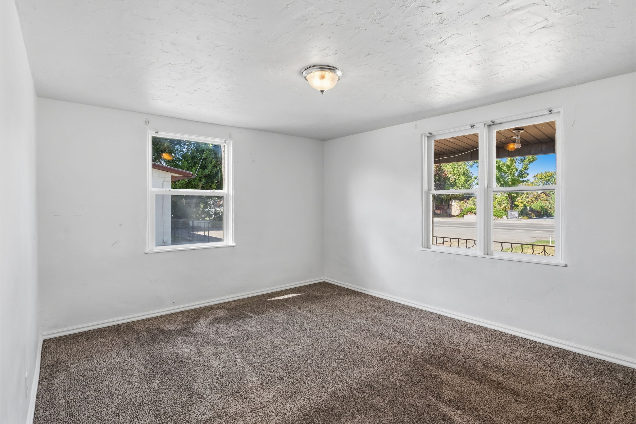 bedroom with 3 windows